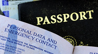 Image of a US passport and the emergency contact page.